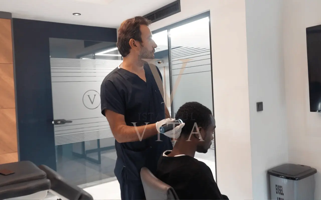dr checking the scalp before hair transplant